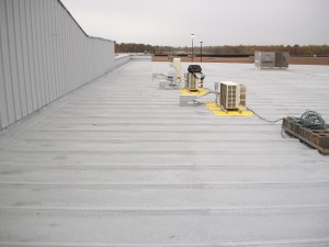 A metal roof coated with silicone and granules.