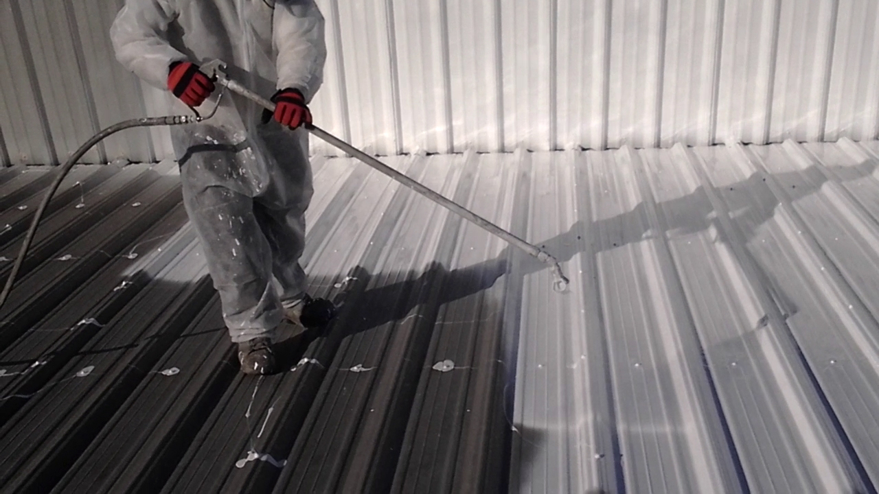 Performing a Silicone Recoat on a Large Flat Roof American WeatherStar